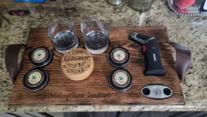 Pieces of glasses on a wooden rack with a lighter