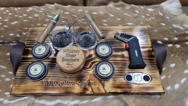 Pieces of glasses on a wooden rack with some cigars