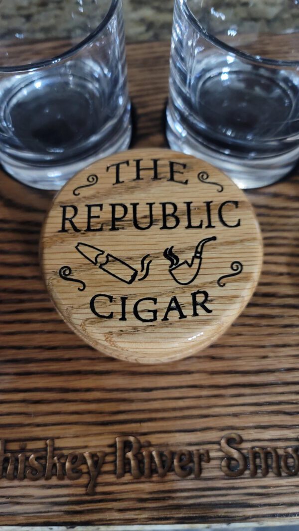 The republic Cigar written on a wooden box on a table